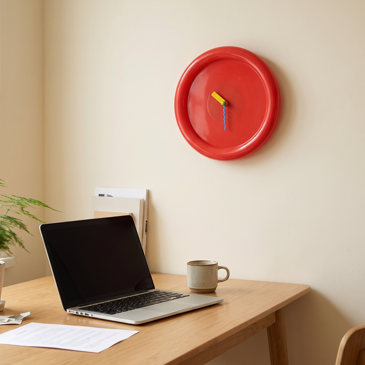 Gera red clock in a home office