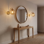Vimmerby amber wall lights either side of a mirror