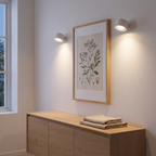Hedemora spotlights above a print in a hallway
