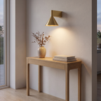 Ansbach gold wall light above a hallway console