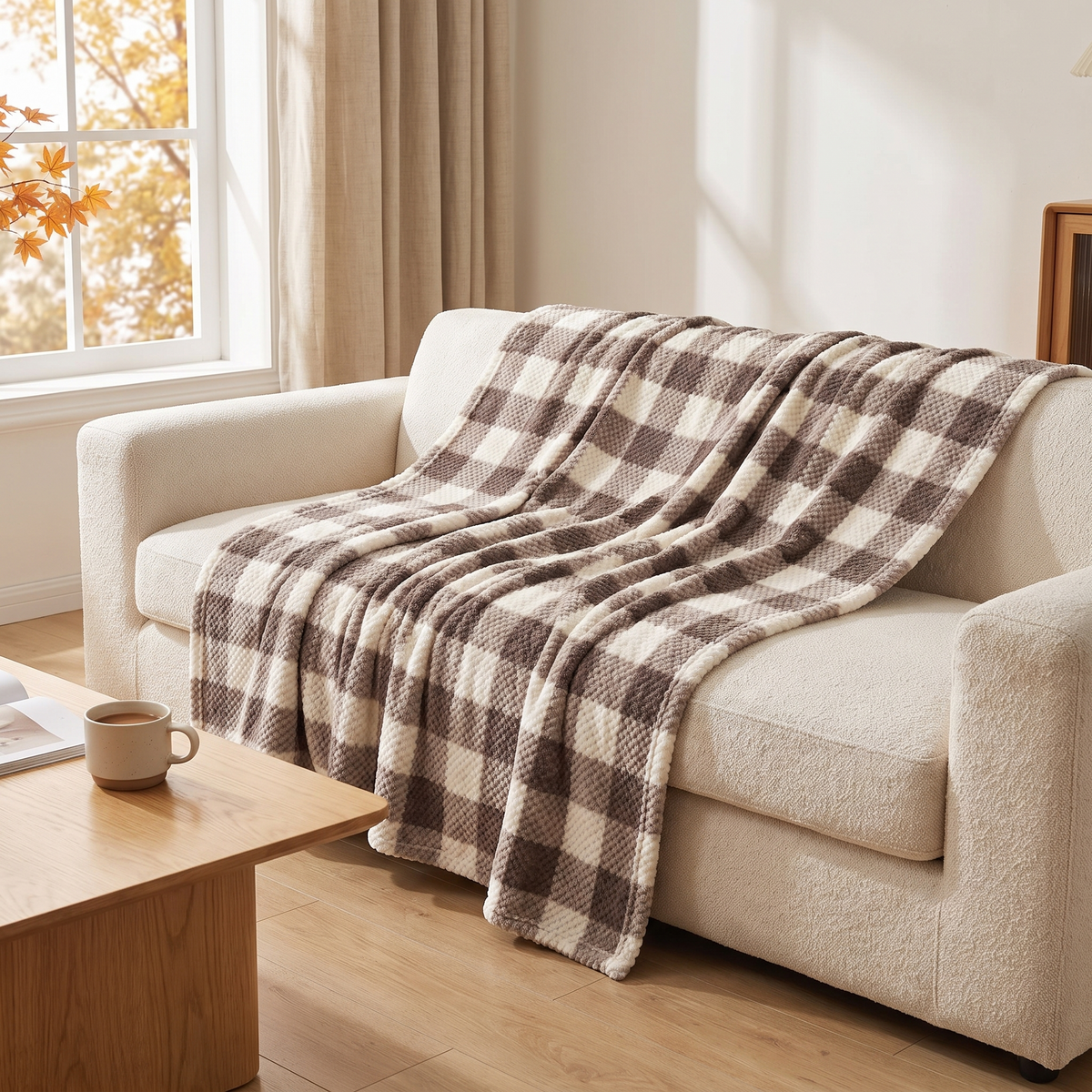 Lulea coffee check throw on a sofa