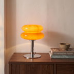 Detmold glass mushroom lamp glowing on a side table