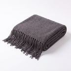 Uelzen knitted tassel throw in charcoal