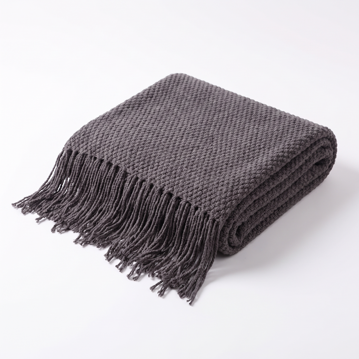 Uelzen knitted tassel throw in charcoal