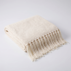 Uelzen knitted tassel throw in cream