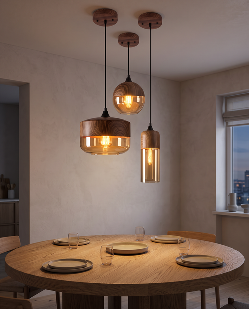 Sundsvall pendants in mixed shapes over a dining table
