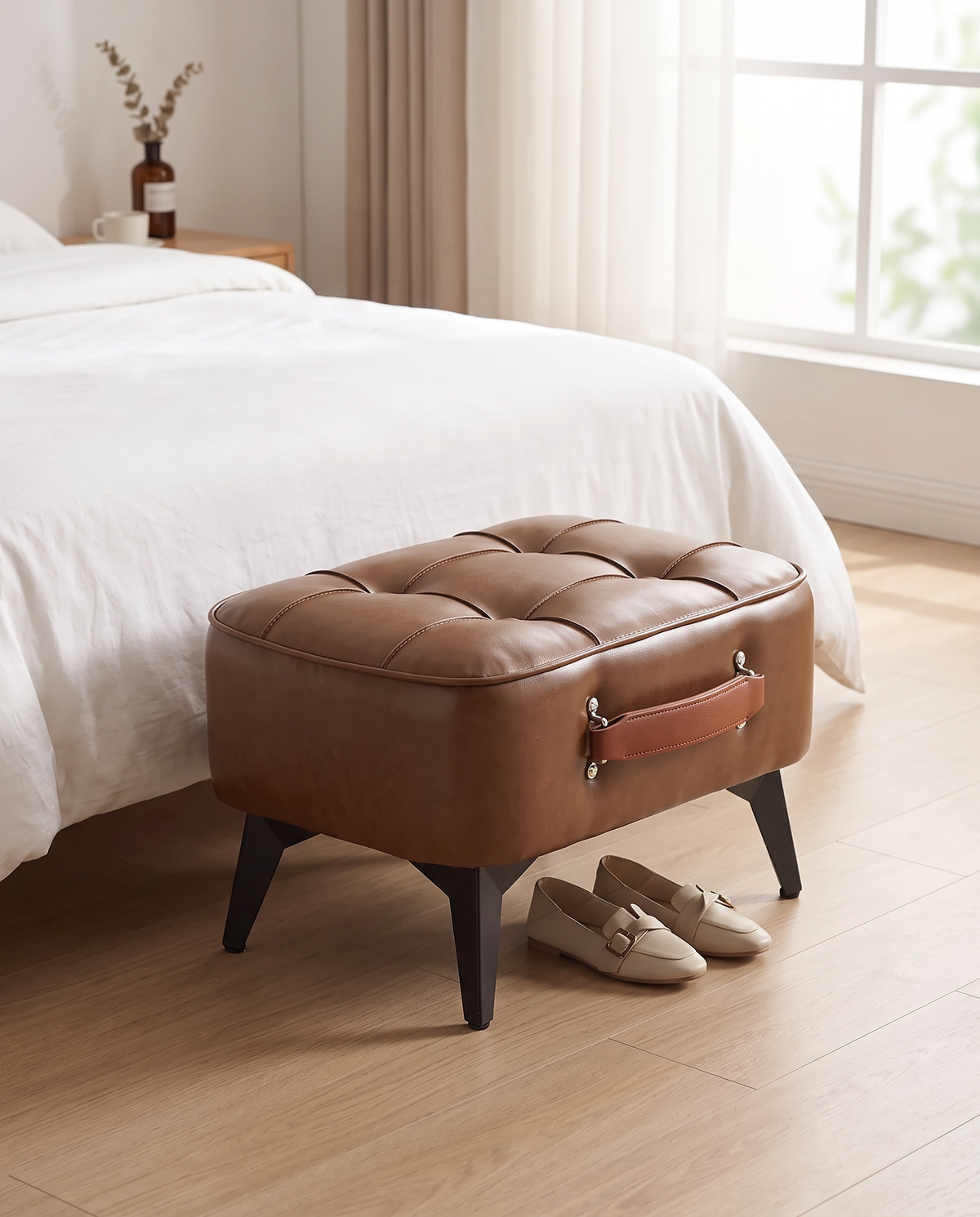Cognac Grenaa footstool at the end of a bed