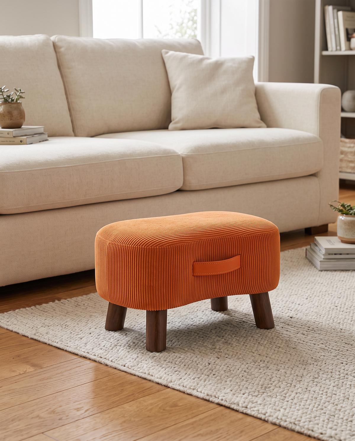 Ikast burnt orange corduroy footstool in a living room