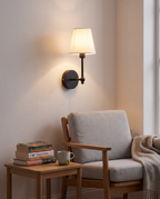 Black Kungalv wall light above a reading chair