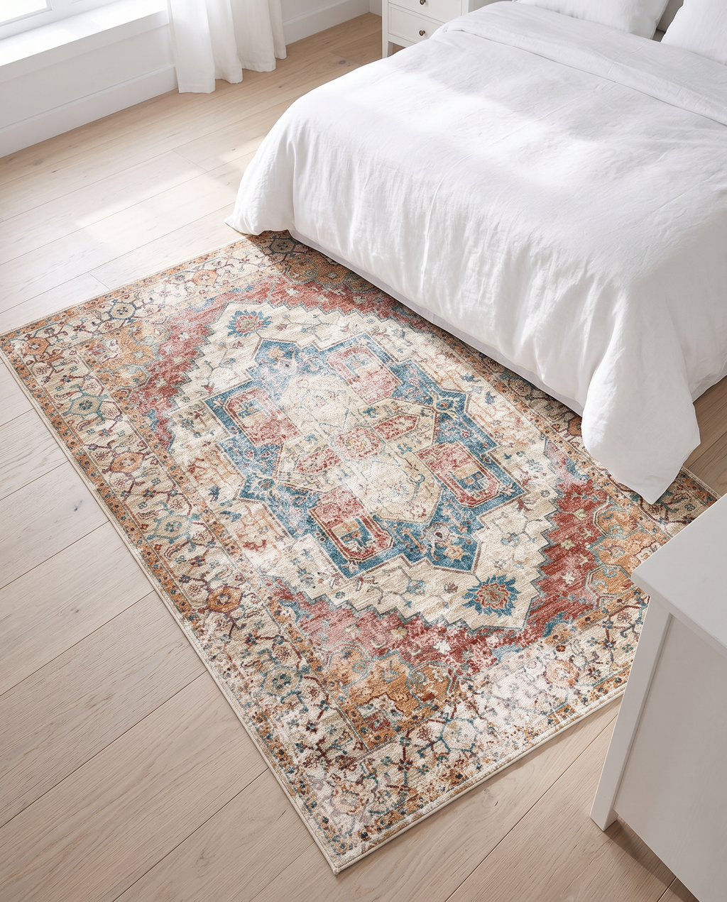 Augsburg faded blue rug in a bedroom