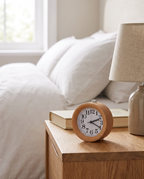 Jever solid wood alarm clock on a bedside table