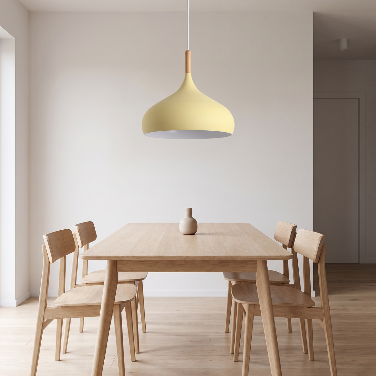 Kalix light yellow pendant above an oak dining table