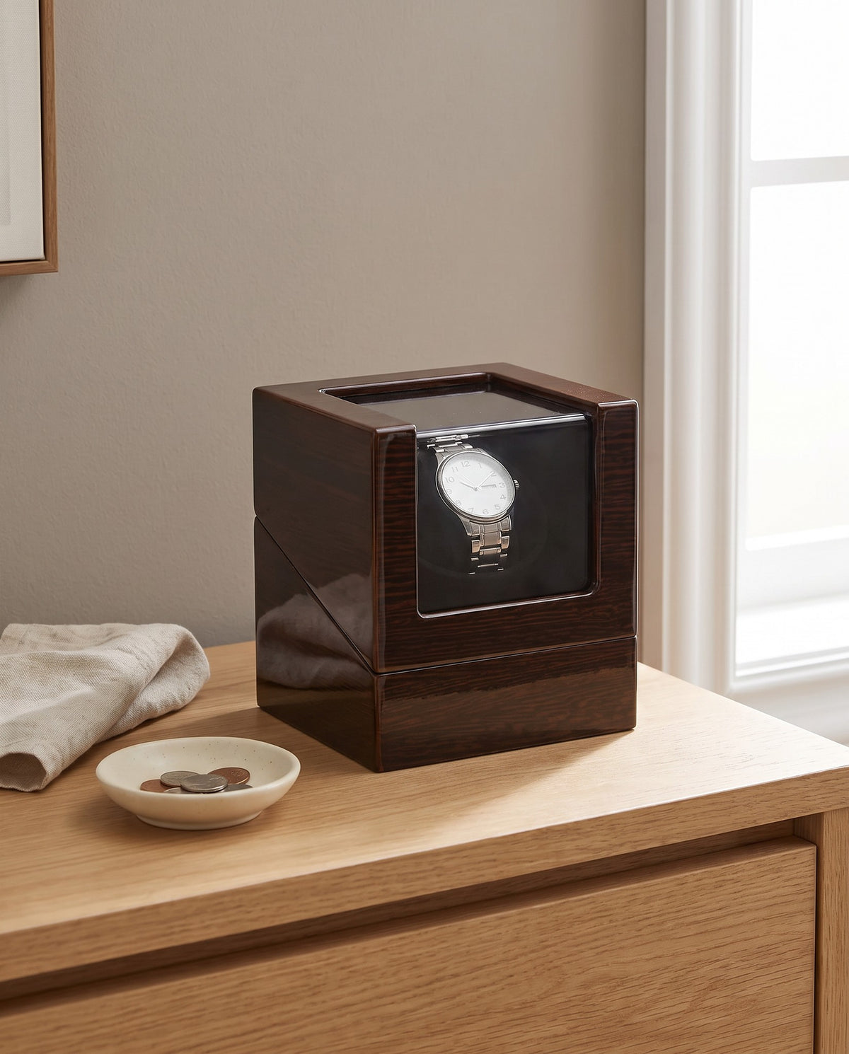 Lahr watch winder on a light oak dresser in a calm bedroom