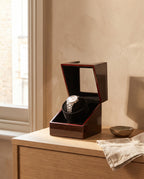 Lahr watch winder with the lid open on an oak dressing table