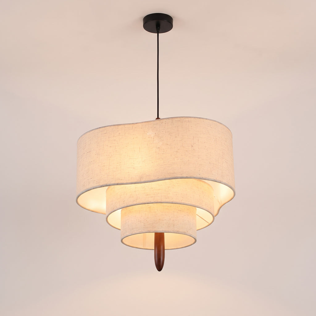 Lauenburg tiered linen look drum chandelier lit, on a light studio background