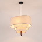 Lauenburg tiered linen look drum chandelier lit, on a light studio background