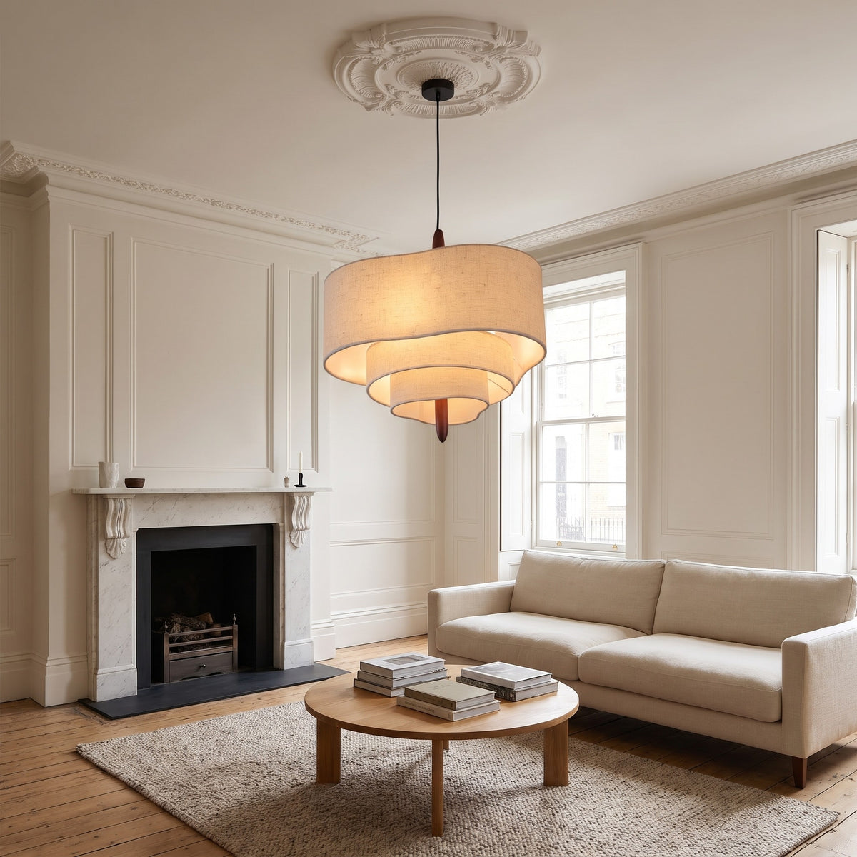 Lauenburg tiered chandelier over a round oak coffee table in a panelled townhouse living room