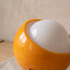 Close up of the Lugano glossy orange glass shell and white opal dome