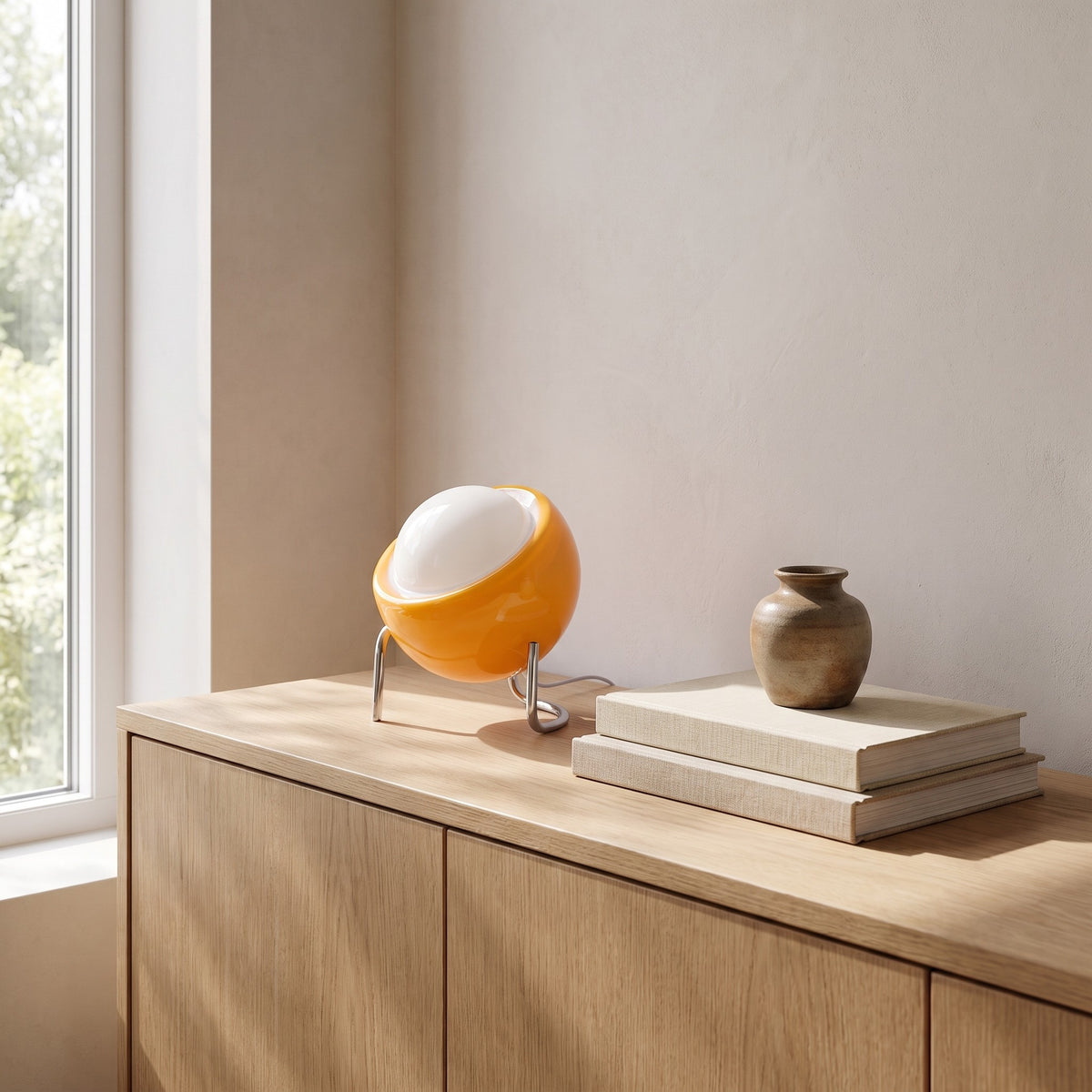 Lugano orange globe table lamp on an oak sideboard