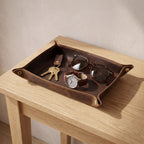Mechelen leather valet tray on a hallway console holding keys, a watch and sunglasses