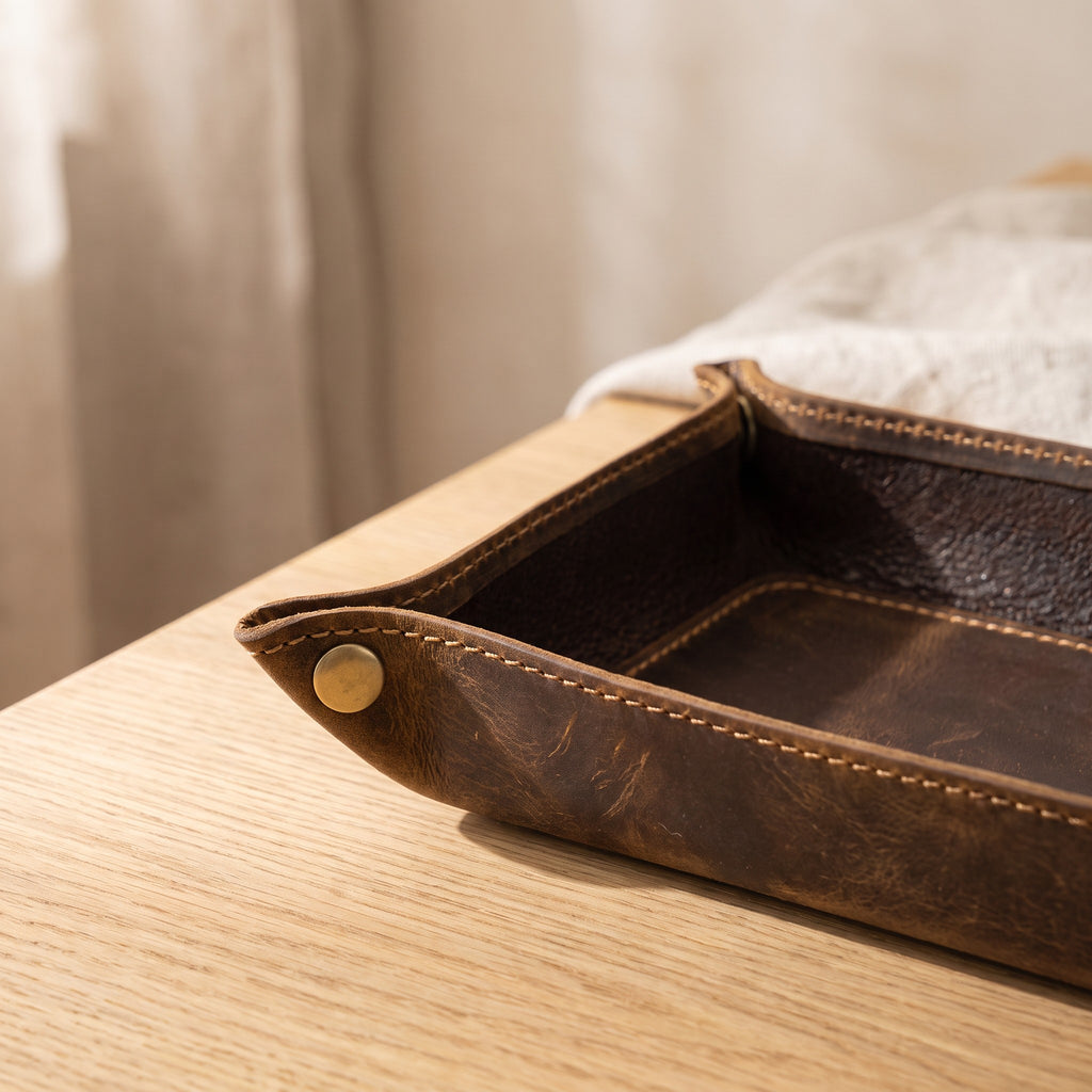 Close up of the Mechelen brass tone snap corner and stitching