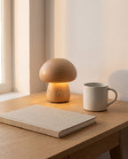 Beech Molln mushroom lamp on an oak desk beside a mug, shown to scale