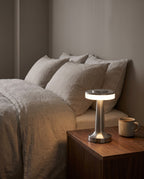 Montreux silver cordless lamp on a walnut bedside table