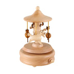 Seiffen wooden carousel music box on a white background