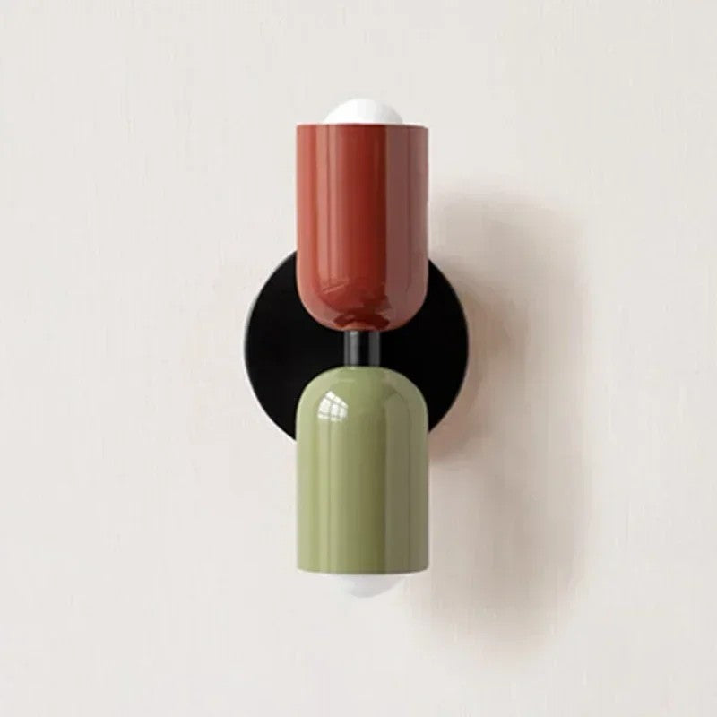Thun rust and sage wall light on a black plate, product photo