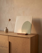 Viersen record stand with a sleeve on an oak sideboard