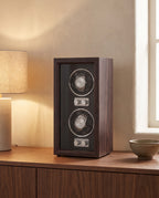 Weiden watch winder on a walnut sideboard beside a table lamp