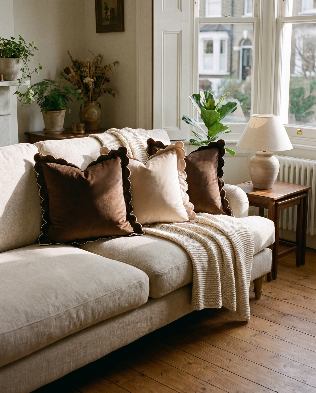 Scalloped velvet cushions styled on a sofa