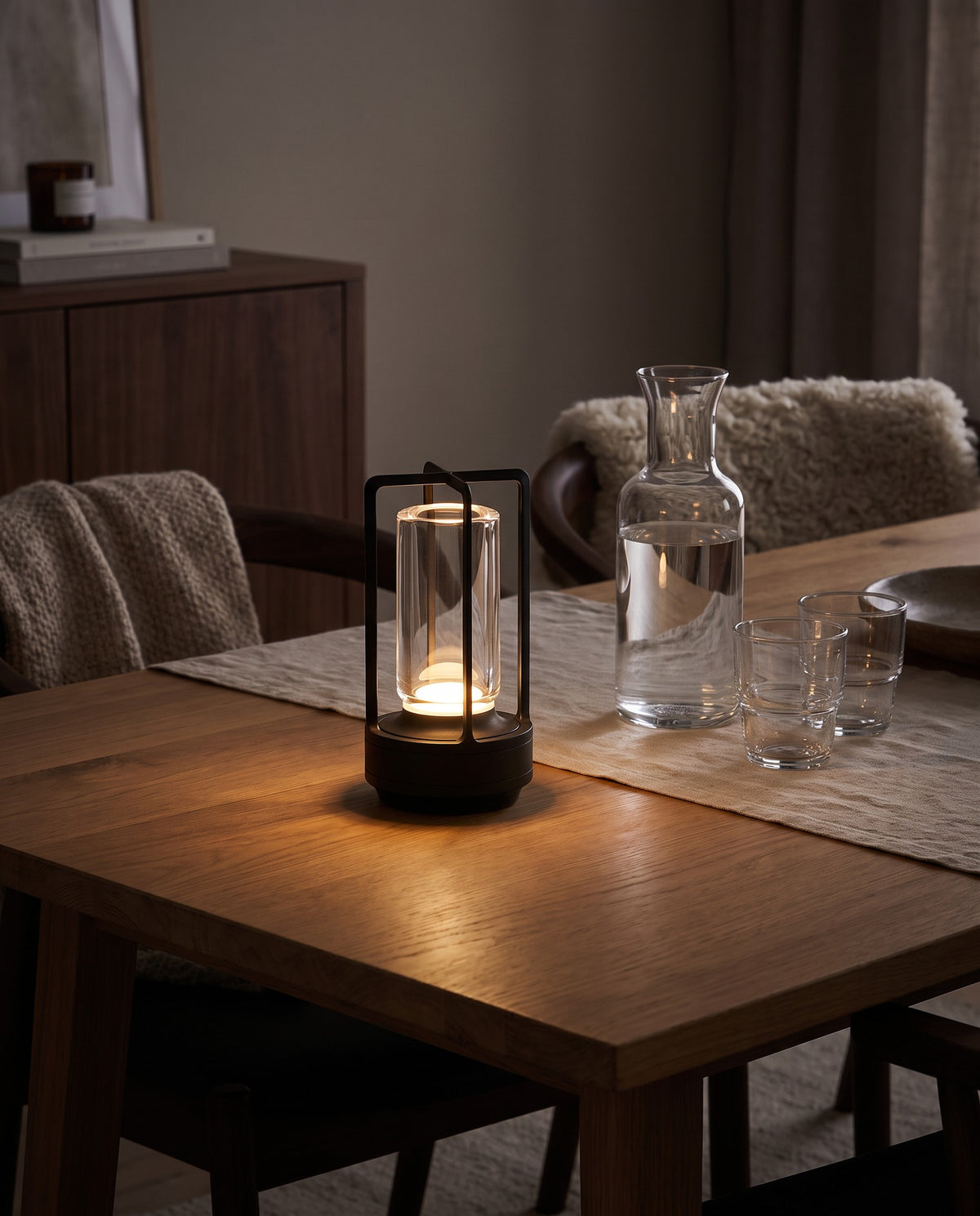 Zermatt black lantern lamp on an oak dining table